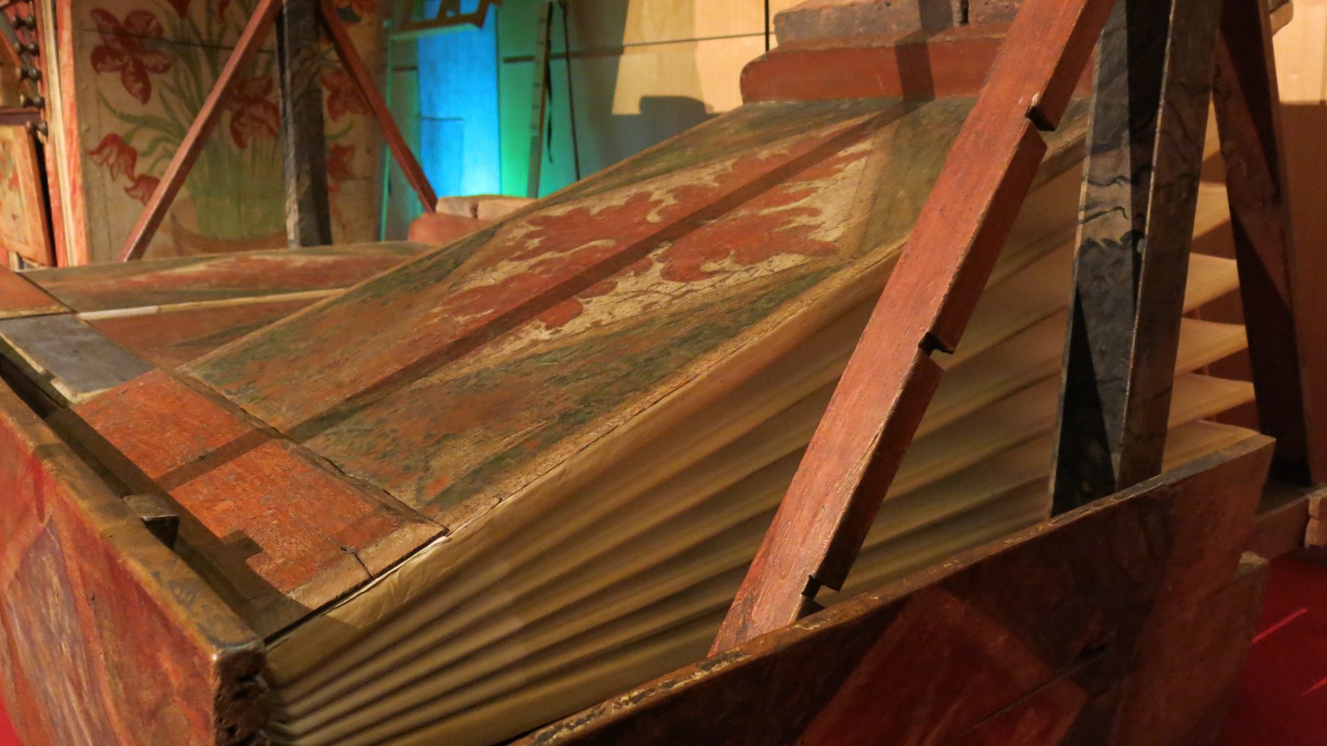 Detail of an antique reservoir and bellows folds awaiting releathering