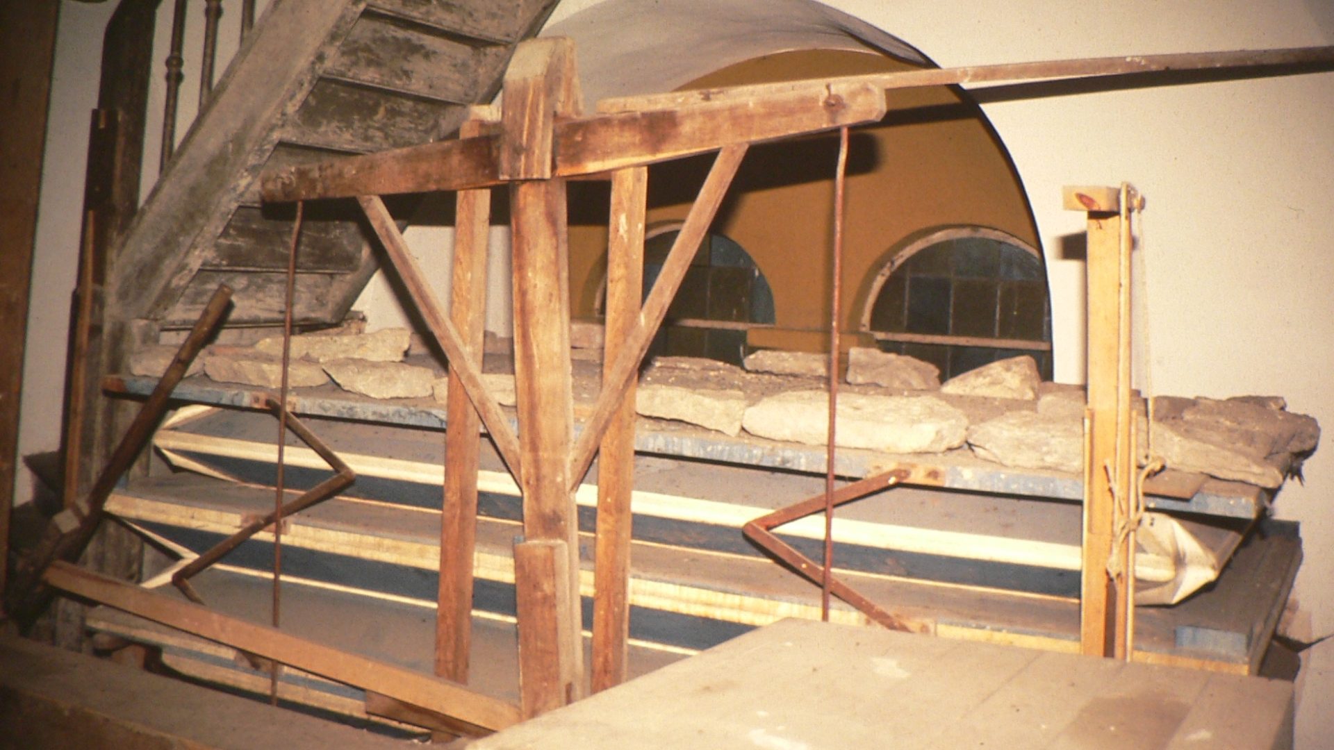 A dilapidated historic wedge bellows photographed before restoration work