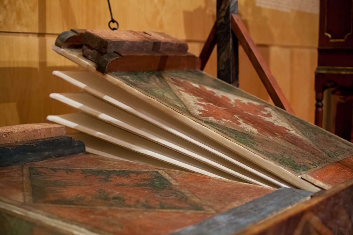 Close detail of a painted historic organ bellows folding leather gusset