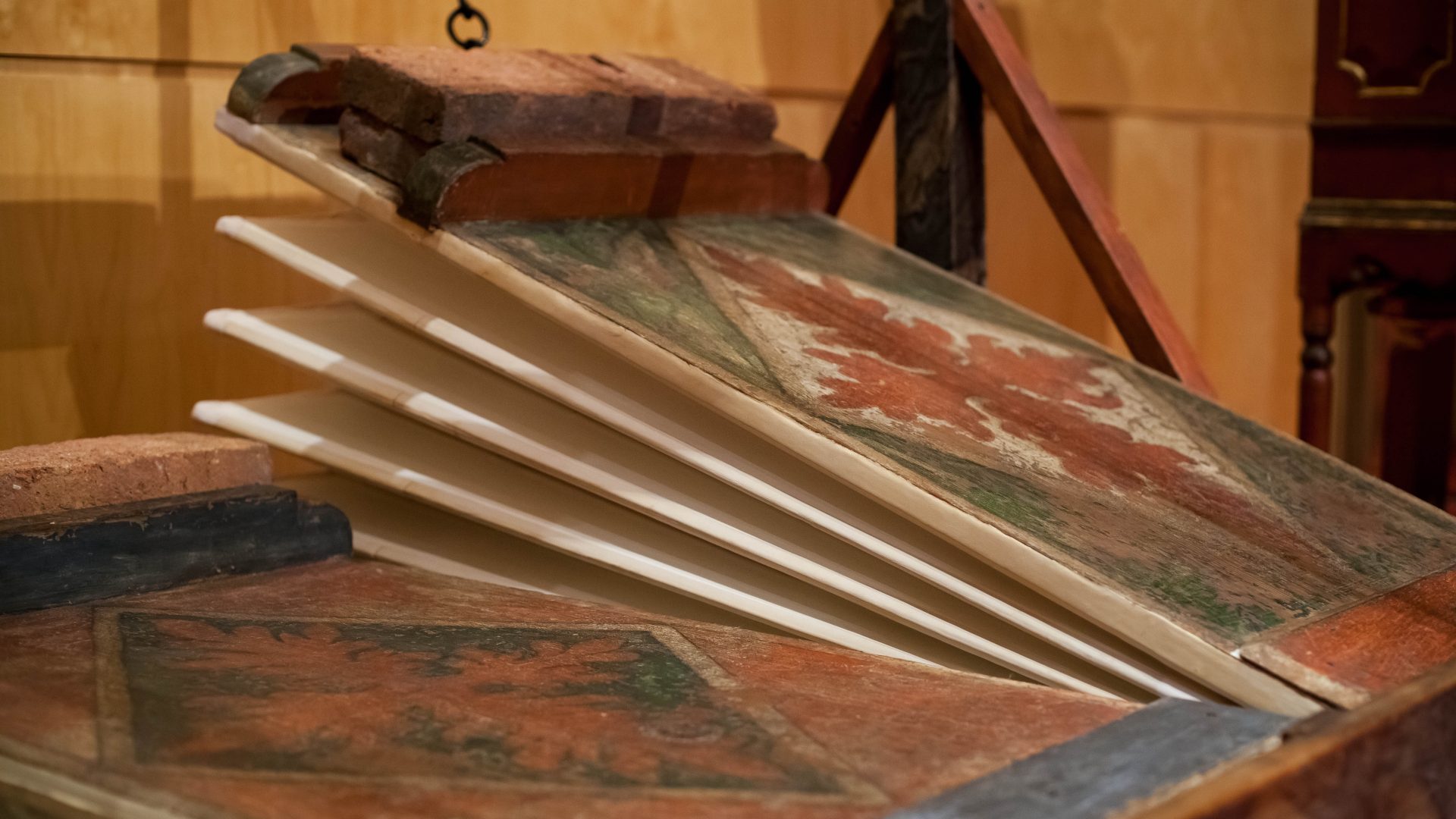 Close detail of a painted historic organ bellows folding leather gusset