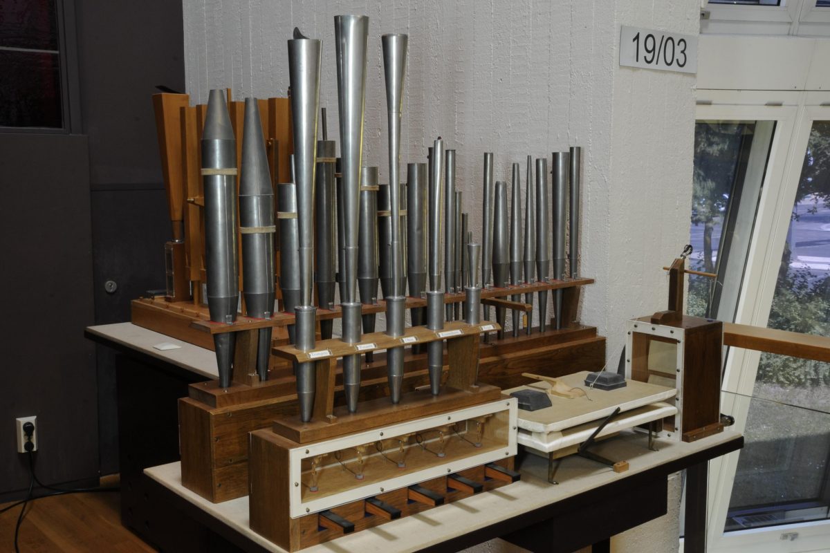 A study display of graduated organ pipe models of varying scale and material