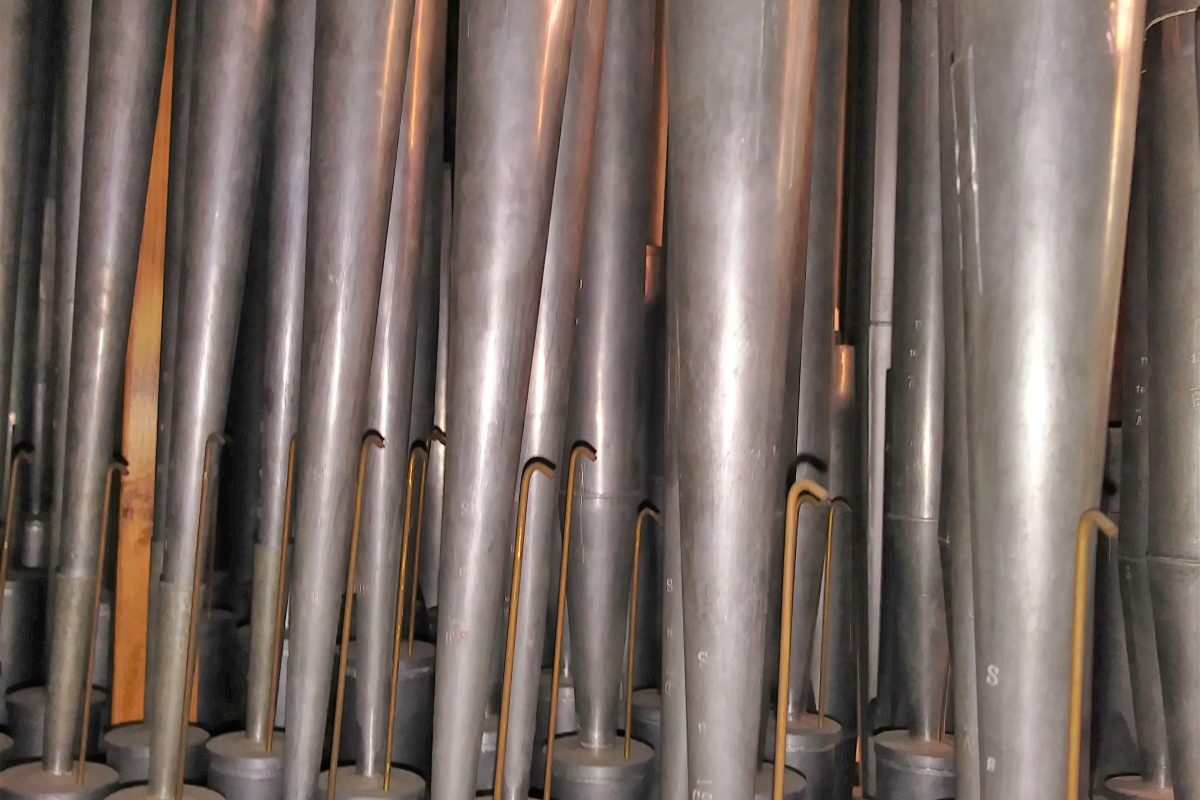 Close view of a Schalmey reed pipe rank prepared for pre-concert voicing