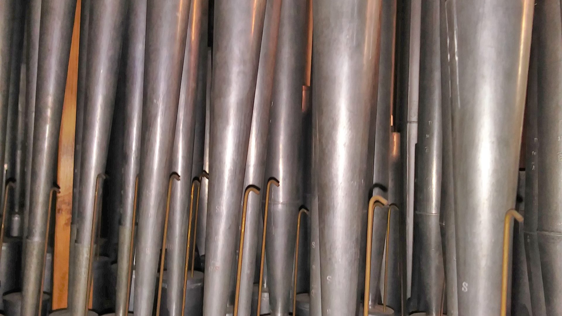 Close view of a Schalmey reed pipe rank prepared for pre-concert voicing